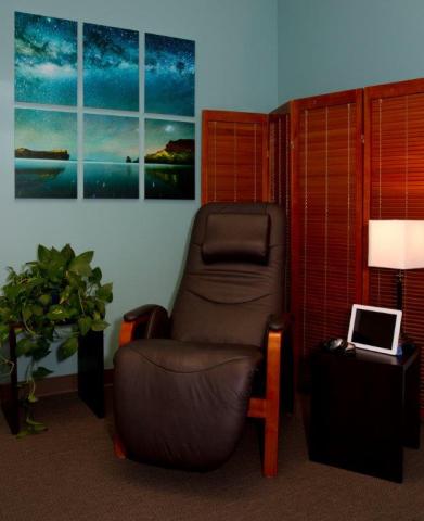 picture of stress reduction room with comfortable chair, photos, etc