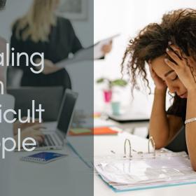 A woman holding her head and looking stressed in a meeting room next to words that read "Dealing with Difficult People".