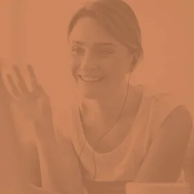 image of a woman waving at the computer