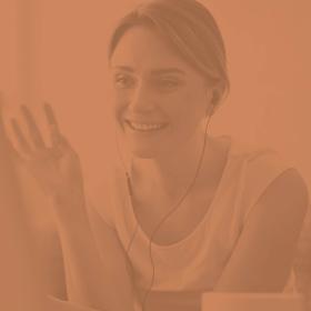 image of a woman waving at the computer