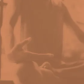 Image of someone sitting cross-legged
