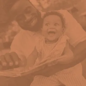 Image of man laughing with child