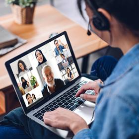 Image of woman on a conference call on her laptop