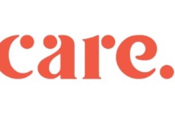 A red text logo for Care.com.