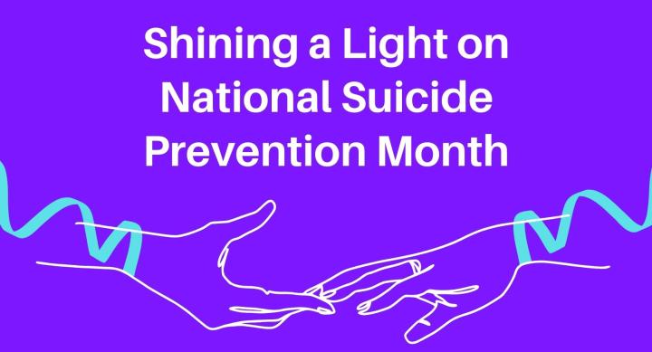 Two hands reaching toward each other with teal ribbons on their wrists and against a purple background with words that read "Shining a Light on National Suicide Prevention Month"